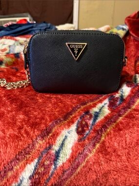 GUESS Black Crossbody Bag with Gold Triangle Logo